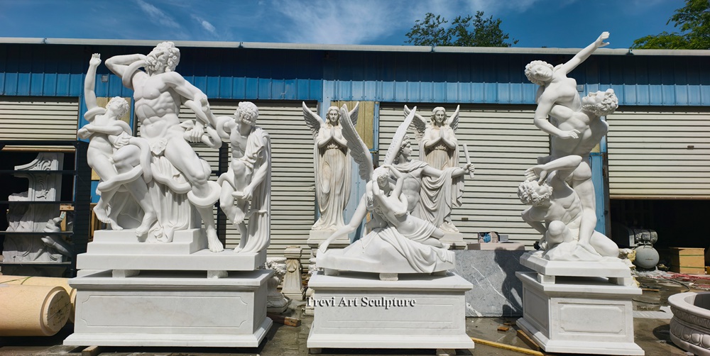 a collection of hand carved white marble master sculpture replicas, including laocoön and psyche revived by cupid's kiss