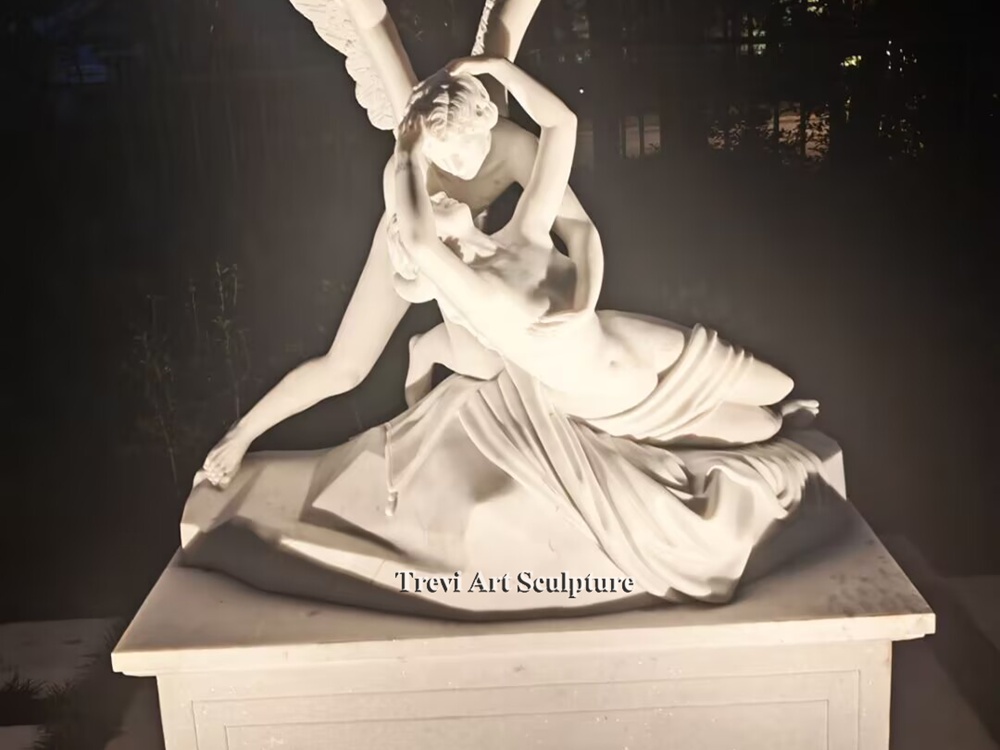 psyche revived by cupid's kiss marble statue highlighted with soft night lighting
