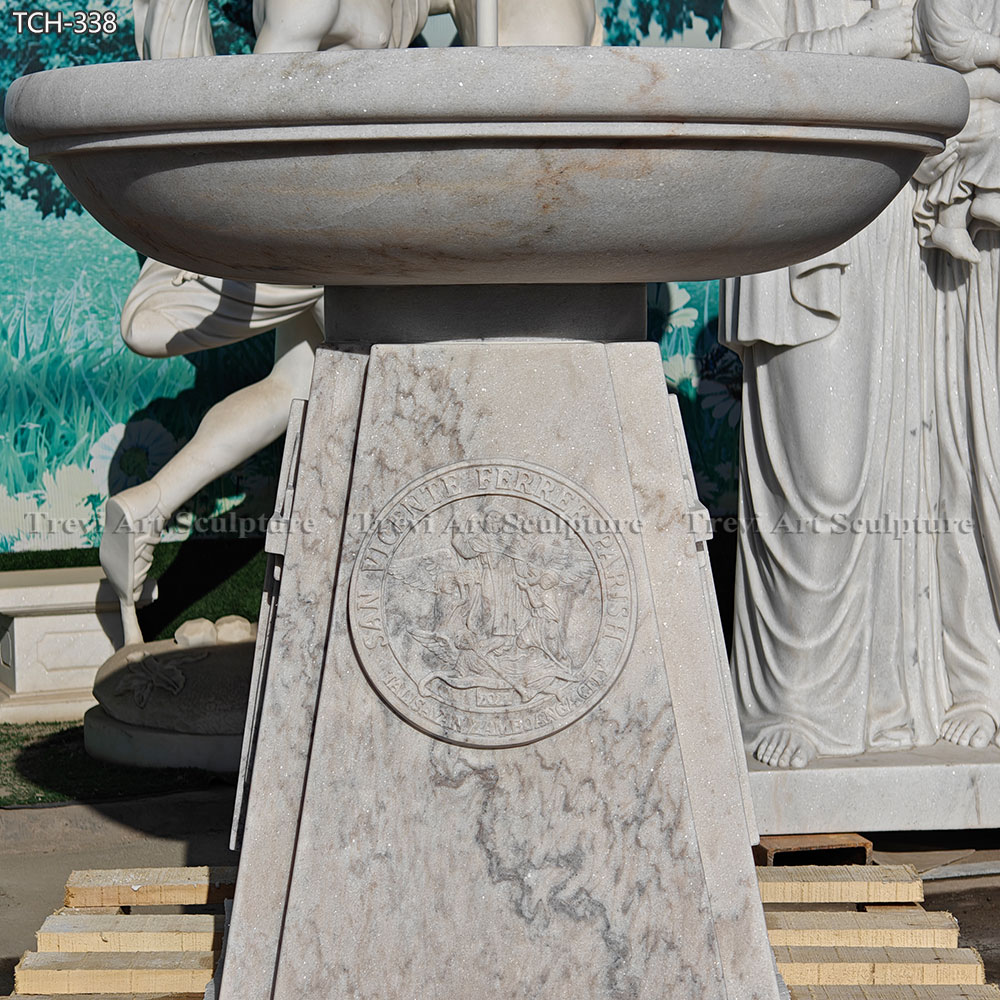 round bowl baptismal font with raised cross details