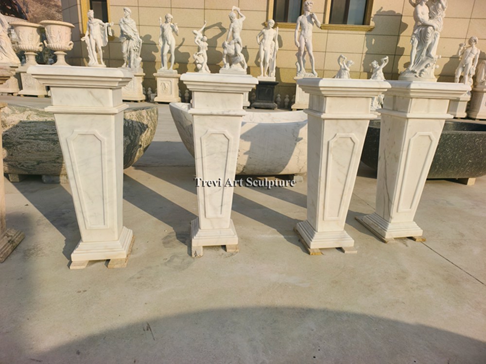 elegant white marble pedestals